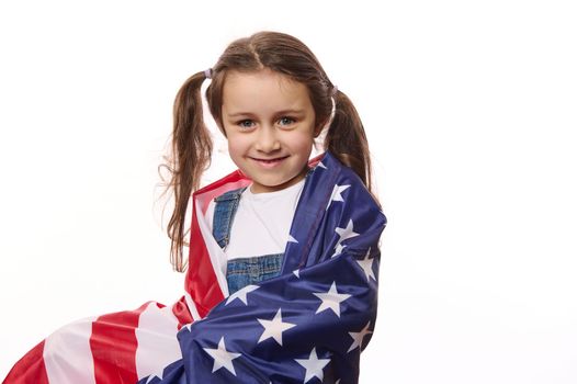 Beautiful little citizen of United States of America- lovely baby girl wrapping USA flag. Citizenships. Independence Day