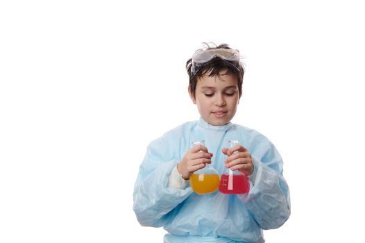 Isolated portrait on white background of a teenager schoolboy doing chemical experiment. Chemistry Science Biology class