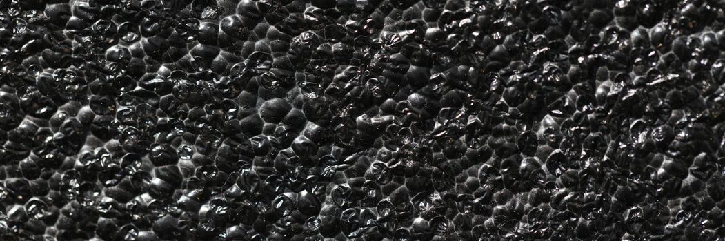 Black rough concrete gravel wall background texture