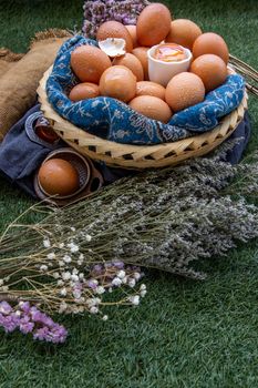 Fresh chicken eggs on basket. Nutrition concept.