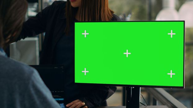 Software developers working on code programming with greenscreen