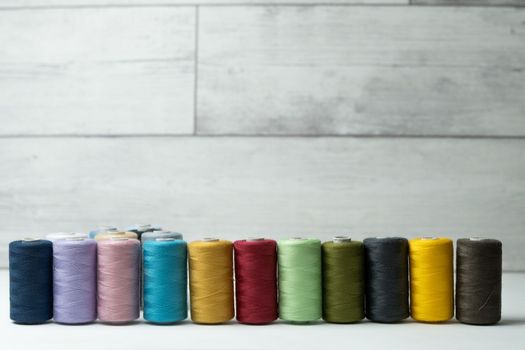 bobbins of sewing thread on white background