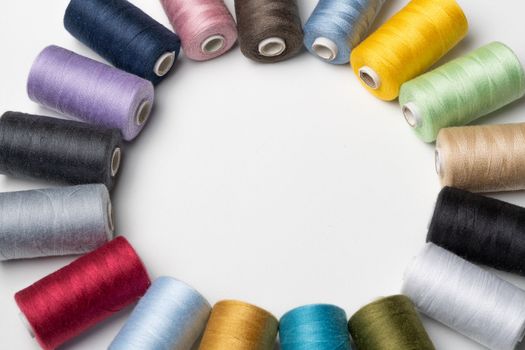 bobbins of sewing thread on white background