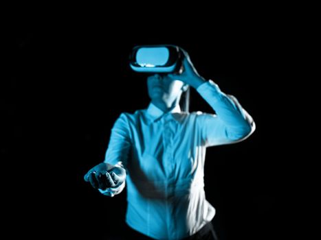 Woman Wearing Vr Glasses And hord Important Messages With one hand. Businesswoman Having Virtual Reality Eyeglasses And Showing Crutial Informations.