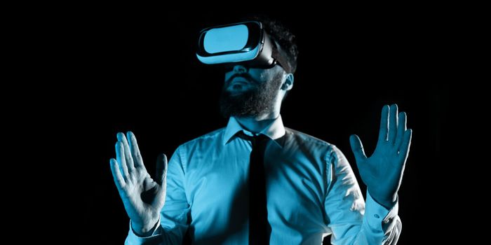 Man Wearing Vr Glasses And Presenting Important Messages Between Hands. Businessman Having Virtual Reality Eyeglasses And Showing Crutial Informations.