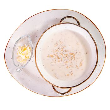 Portion of oatmeal porridge with butter