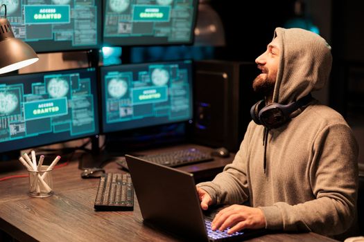 IT male hacker using computer to break system