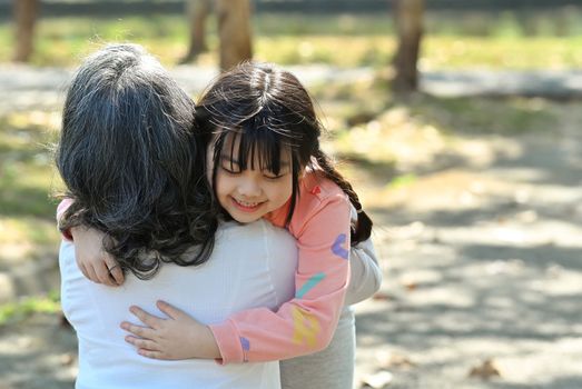 Adorable little asian girl hugging grandma, happy moment, best friend gratitude for love concept