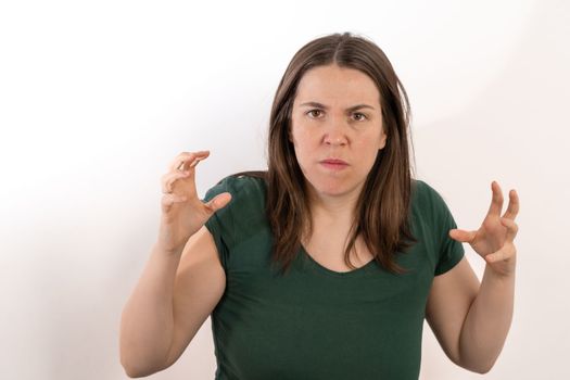 woman looking at the camera with a gesture of anger and rage