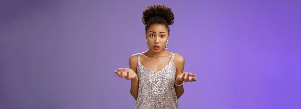 Concerned frustrated and confused attractive african-american curly-haired girl cannot understant what happening raise hands clueless dismay look questioned silly asking what did wrong