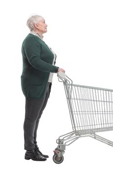 Side view of happy woman pushing an empty shopping cart