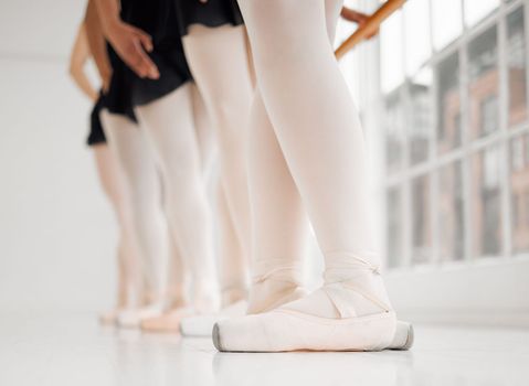 Passion cant be bought. a group of ballerina dancers practicing a routine in their pointe shoes.