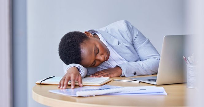 I need a few hours to sleep. young businesswoman taking a nap at work.