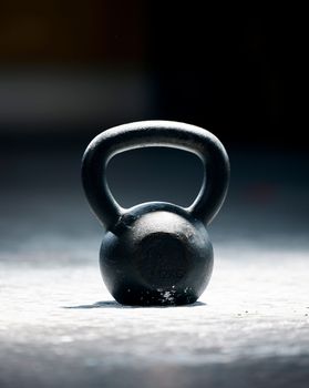 Fitness, motivation or kettlebell at a gym with mockup space for strength training, exercise or workout. Zoom, metal equipment or heavy weight for strong muscle development or growth in health club