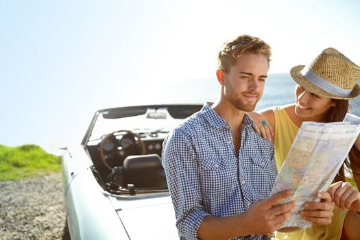 Road trip, adventure and couple with map by car on summer holiday, vacation and weekend getaway by ocean. Travelling, freedom and man and woman reading paper for directions, navigation and journey