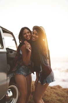 Whats a road trip without your bestie. two young friends stopping at the beach during their roadtrip.
