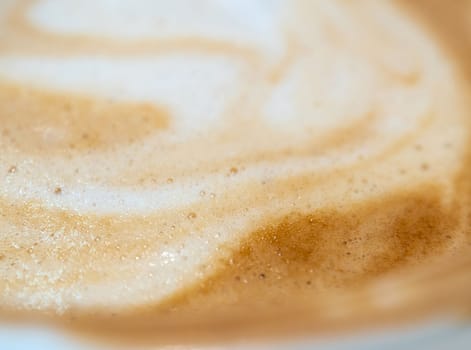 Texture surface of soft and delicate milk froth in a cup of coffee