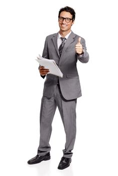 I made the right decision not to sell. A handsome young executive giving you a thumbs-up while holding a newspaper.