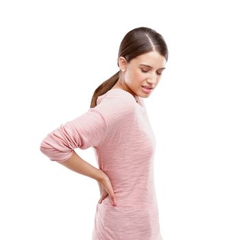 Woman, studio and back pain from stress, burnout or spine health problem isolated on a white background. Female with bad body posture or muscle injury in studio for anatomy, fibromyalgia and massage