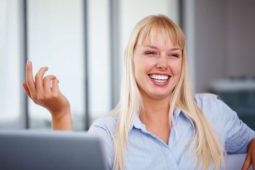 Woman daydreaming and smiling. Young business woman with laptop day dreaming and smiling.