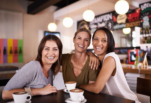 Fun with their besties. Portrait of three friends having fun at a coffee shop together.