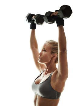 And hold. a beautiful young woman in workout gear lifting dumbbells.