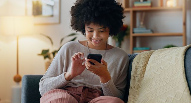 Social media phone, happy email and black woman with smile for mobile app notification, reading news on the internet and chat on the web. African girl in communication on smartphone on lounge sofa.