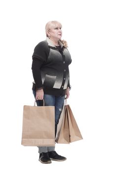 full-length. casual woman in jeans with shopping bags.