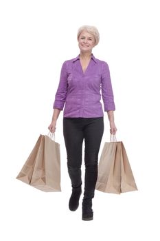 in full growth. smiling casual woman with shopping bags.
