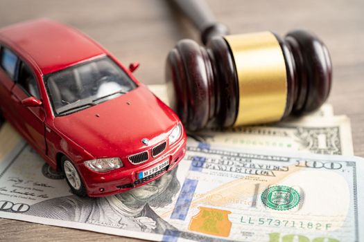 Bangkok, Thailand, January 1, 2023 Hammer gavel judge and money with car vehicle accident, insurance coverage claim lawsuit court case.