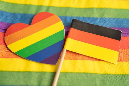 Germany flag on rainbow background symbol of LGBT gay pride month, symbol of lesbian, gay, bisexual, transgender, human rights, tolerance and peace.