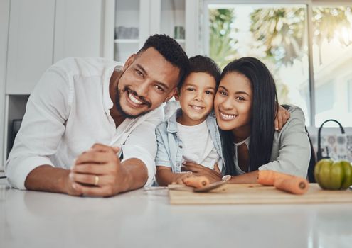 Kitchen, portrait and parents with their boy child to cook dinner, supper or lunch together. Love, smile and happy family from Brazil preparing healthy food or meal with vegetables in their house.