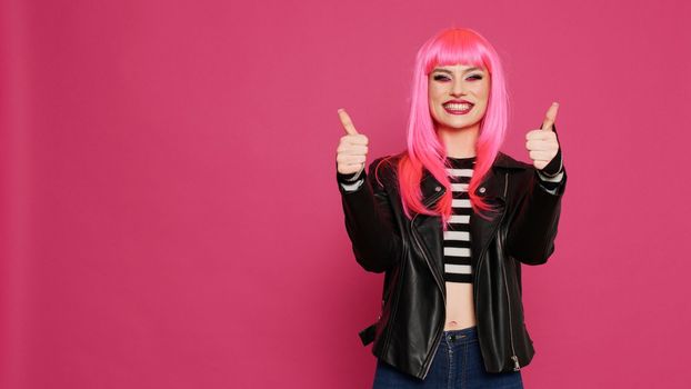 Glamour positive girl showing like and thumbs up symbol