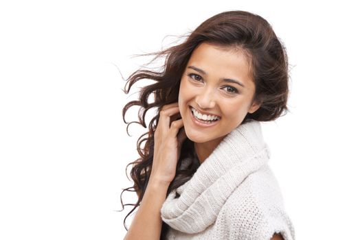 Casual happiness. A smiling woman in winter clothing with a white background and copyspace.