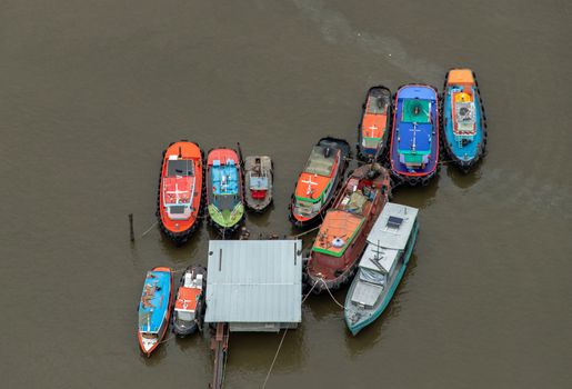 Bangkok, Thailand - 09 Jul 2021 : Many boats docked in the Chao Phraya River in the evening, Top view. Selective focus.
