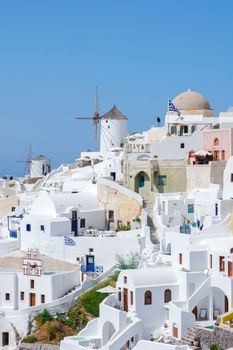 Oia Santorini Greece on a sunny day during summer with whitewashed homes and churches, Greek Island