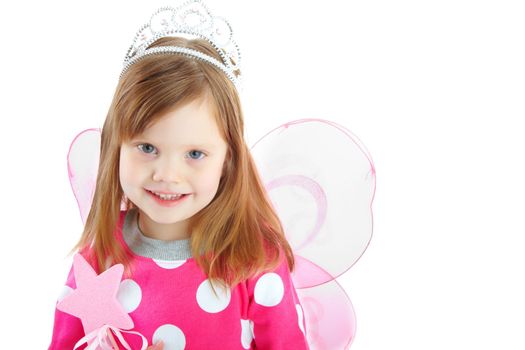 Tiny fairy princess. Portrait of a playful little girl smiling while dressed as a fairy and isolated against a white background.
