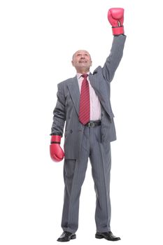 Businessman with boxing gloves on with camera focus on the man