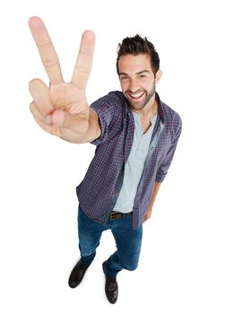 Its all good. Studio shot of a young man showing the peace sign against a white background.