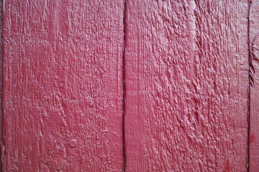 Dont go plain, go artistic. a wooden surface painted red.