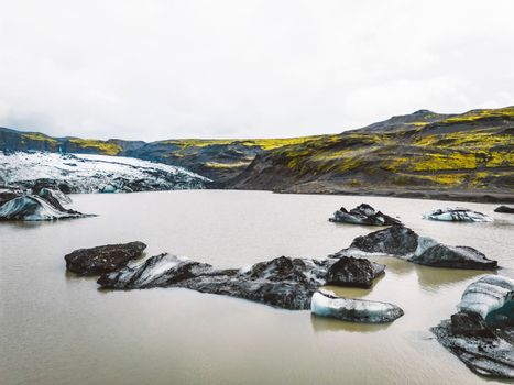 Icelandic glacier lagoon bay with icebergs flowing into the sea