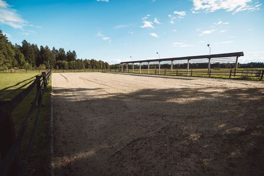 Fenced riding ring, for horse back riding on a sunny day at the ranch
