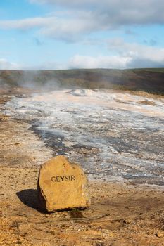 Stone marking the site of geyser in Iceland