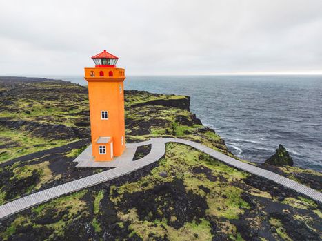 Scenic lighthouse at the edge of the cliff, Svortuloft Lighthouse, lava landscape