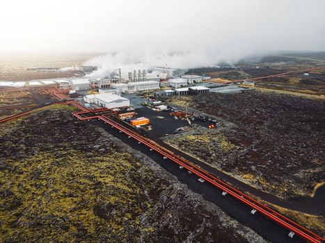 Large geothermal power plant in Iceland, stem coming out of the chimneys of the power plant 
