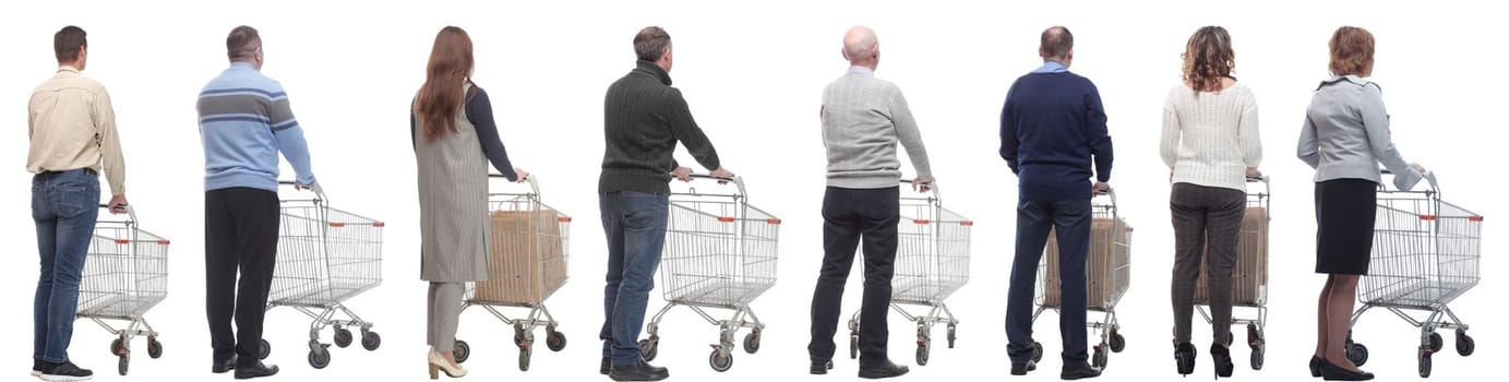 a group of people with a cart stand with their backs isolated