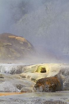 The beauty of Mother Nature. mist descending over a rocky tidal pool.