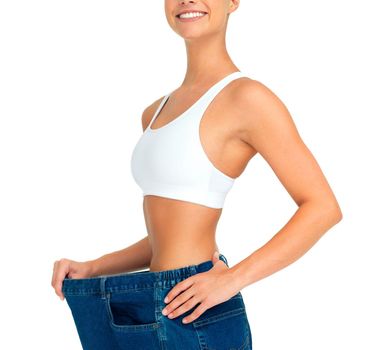 Health, weight loss and diet, woman with jeans and tummy tuck with skinny waist, cropped and isolated on white background. Fitness, healthcare and wellness, girl with slim figure and shrinking pants.