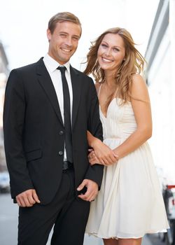 Valentines date, love and couple portrait with a smile ready for romance and happiness on a street. Suit, smile and happiness of a fancy woman and man together with care on dates for engagement