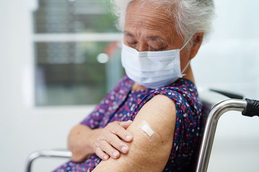 Asian elder senior woman getting vaccine for protect corona virus.